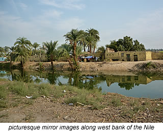 mirror images in Nile river on west bank Egypt