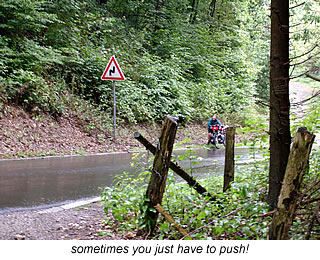 pushing the loaded bicycle up German roads