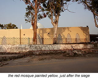 red mosque painted yellow after seige in Islamabad